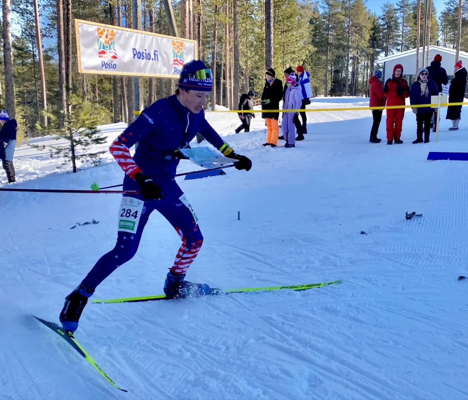 Erik Fey racing through forest terrain
