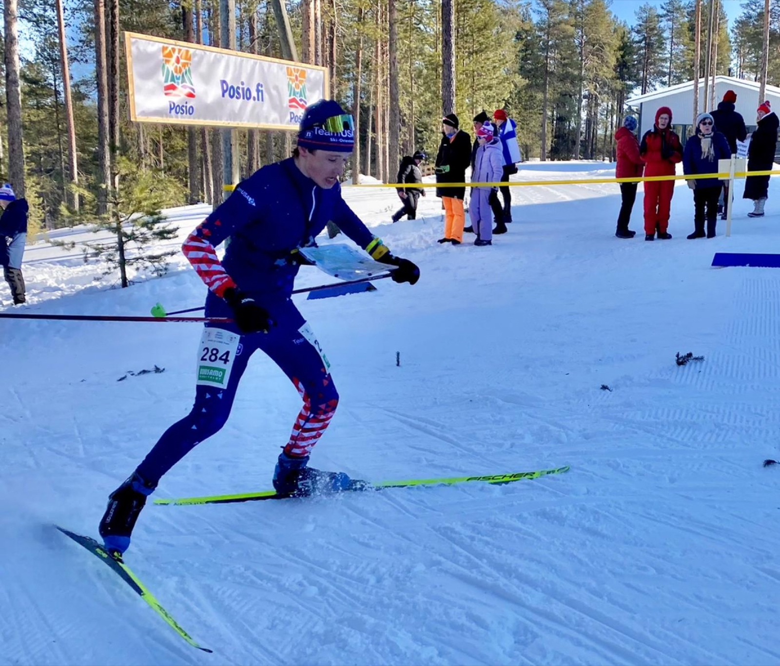 Erik Fey racing through forest terrain